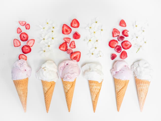 Photo of ice cream with strawberries and vanilla flowers